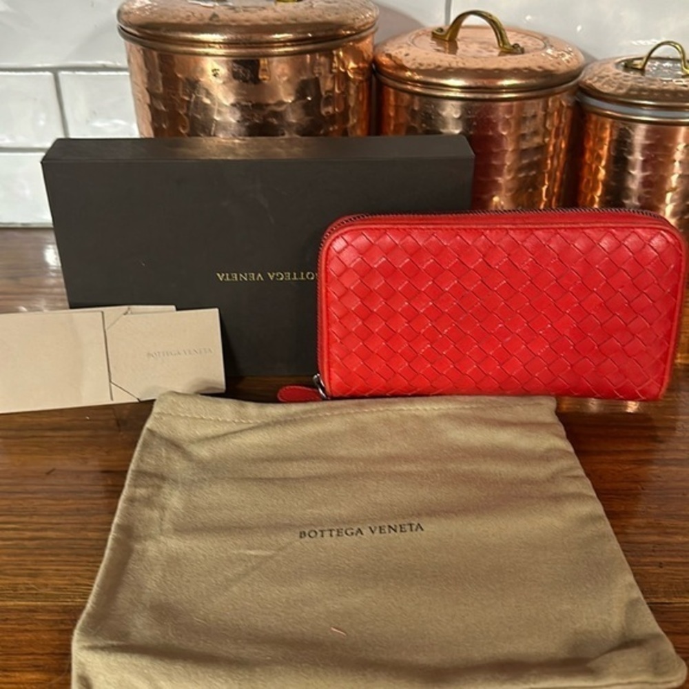 Bottega Veneta red wallet.